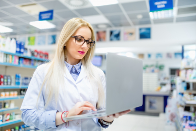 pharmacist searching for antibiotics on laptop